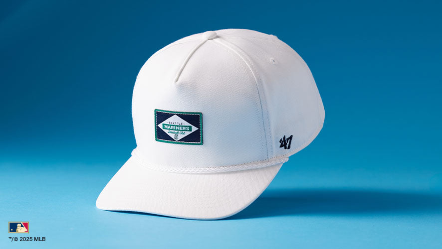 Milkwood Rope '47 Hitch. A sleek all-white snapback with subtle team patch and braided visor rope.